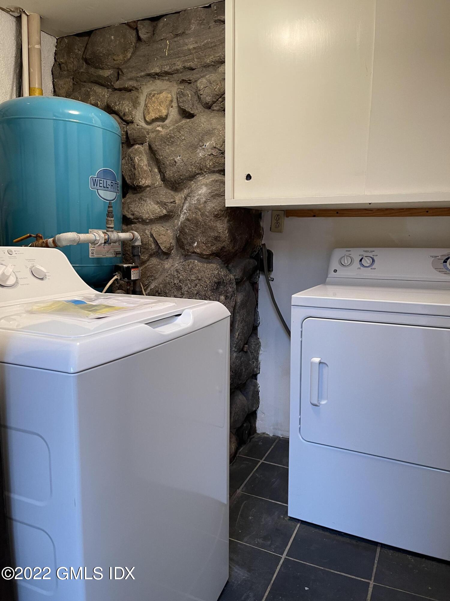 331 Stanwich Road Greenwich, CT 06830 - Photo 9 of 28 a utility room with dryer and washer
