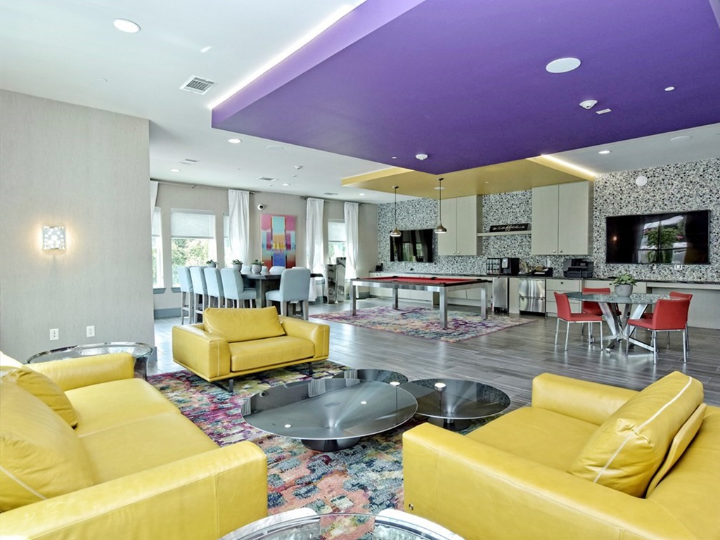 1900 Barton Springs Road, Unit 3040 Austin, TX 78704 - Photo 31 of 38 Spacious common area featuring wood-finish flooring, a vibrant purple ceiling detail, and recessed lighting