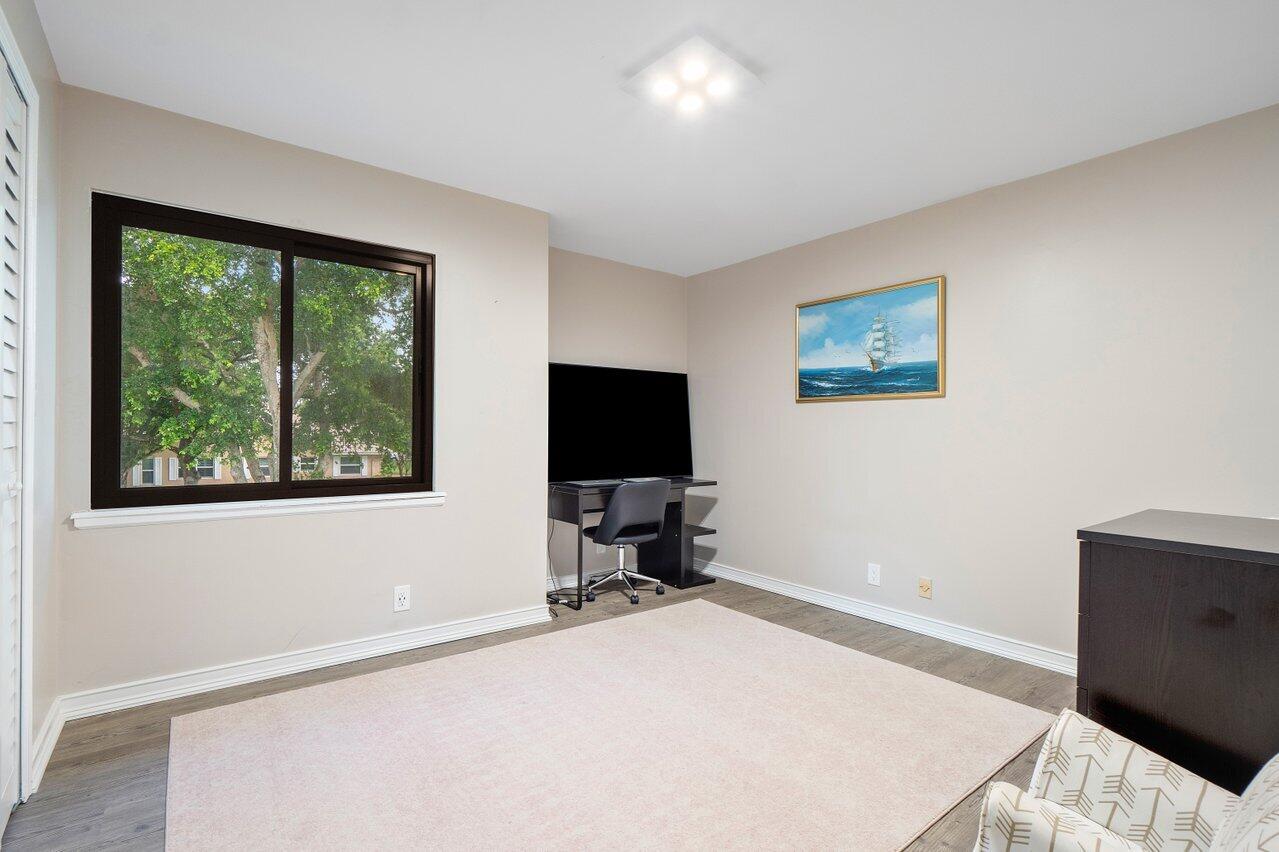 2296 Northwest 36th Street Boca Raton, FL 33431 - Photo 35 of 70 a room with a bed and a window