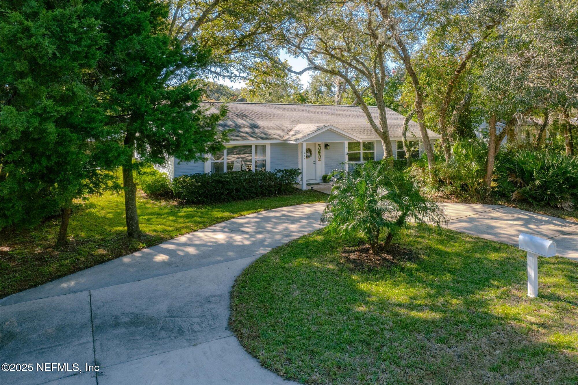 904 San Jose Road St. Augustine, FL 32086 - Photo 1 of 31 a front view of a house with a yard and porch