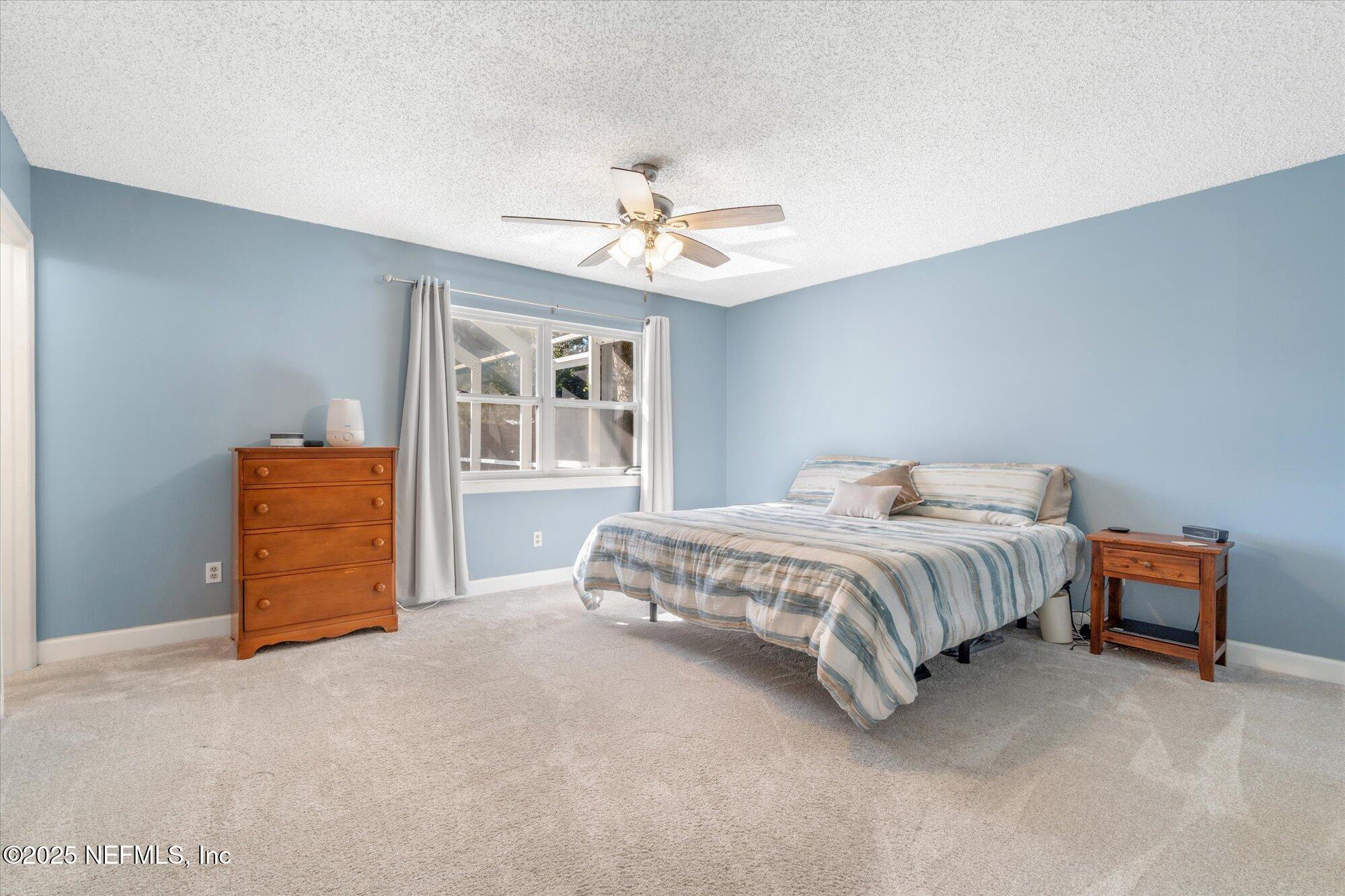 904 San Jose Road St. Augustine, FL 32086 - Photo 16 of 31 a spacious bedroom with a bed and dresser