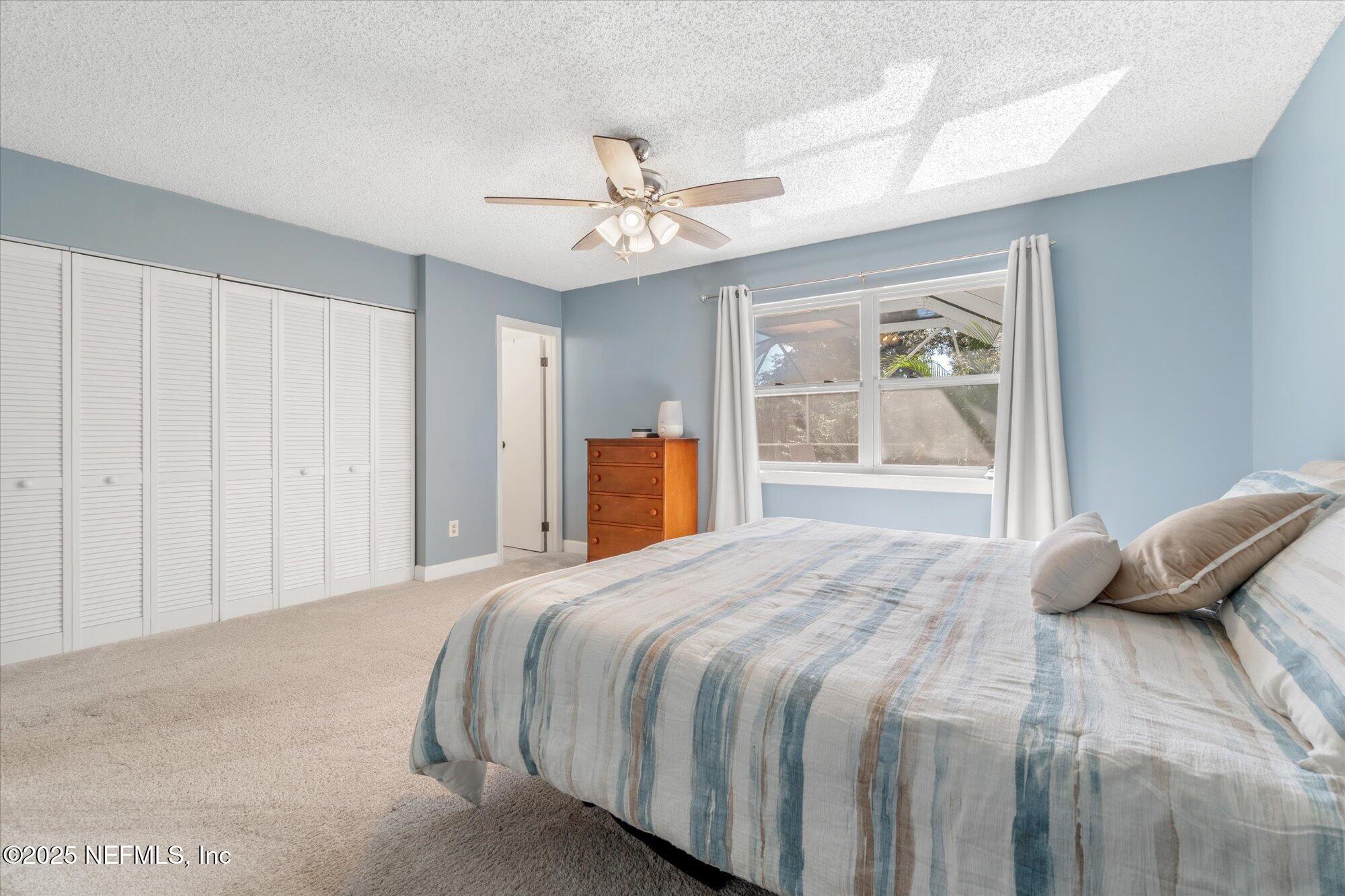 904 San Jose Road St. Augustine, FL 32086 - Photo 17 of 31 a bedroom with a bed and window