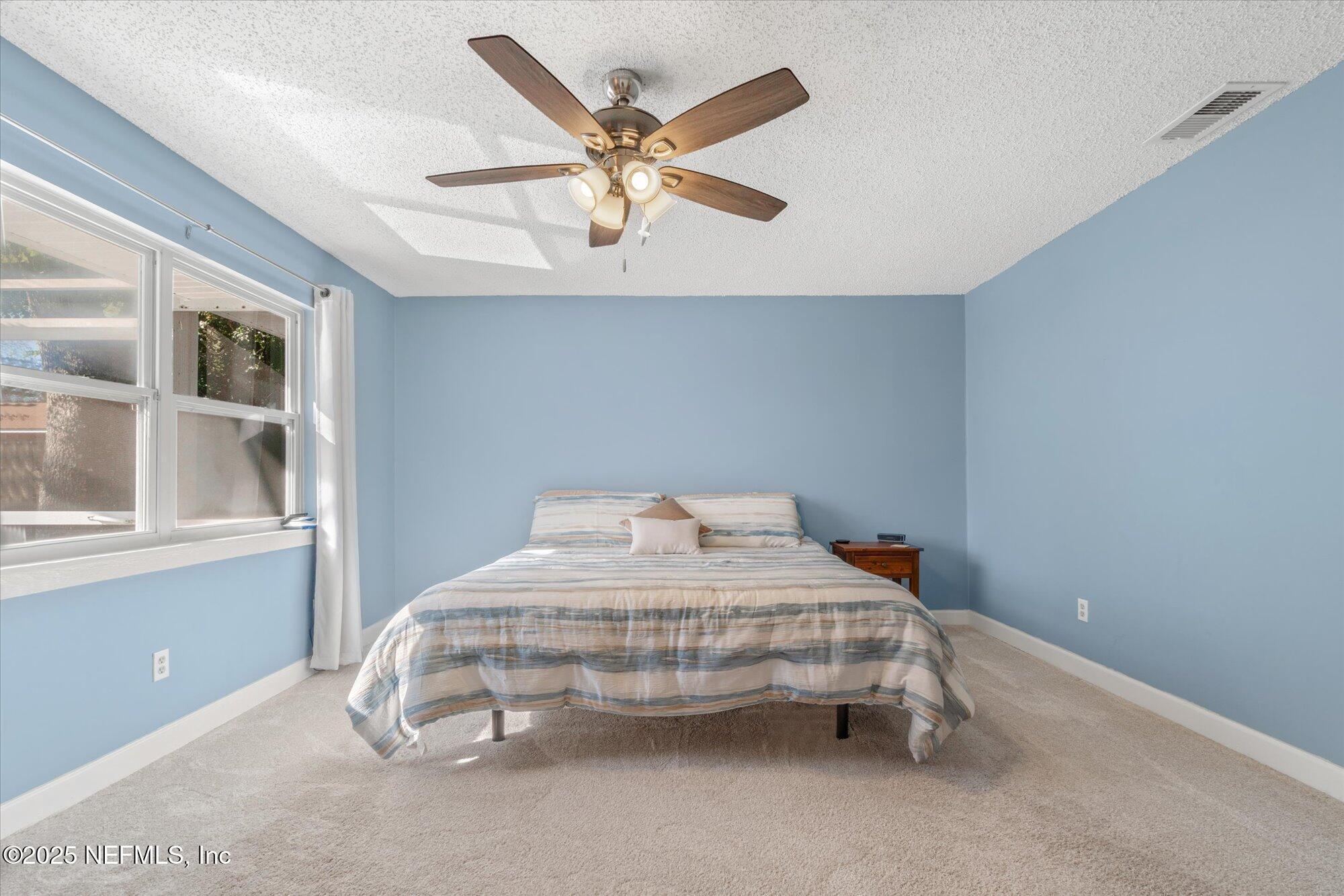 904 San Jose Road St. Augustine, FL 32086 - Photo 18 of 31 a bedroom with a bed and window