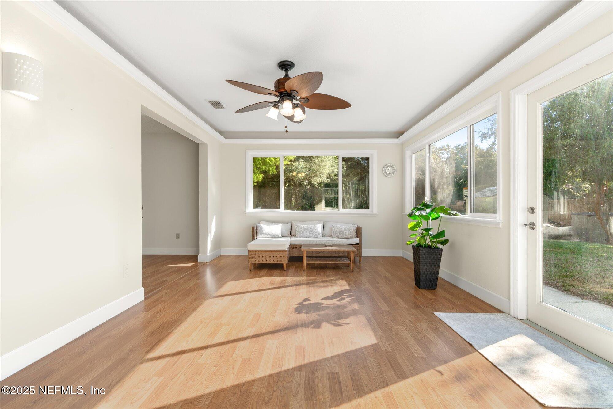 904 San Jose Road St. Augustine, FL 32086 - Photo 2 of 31 a living room with furniture and a potted plant