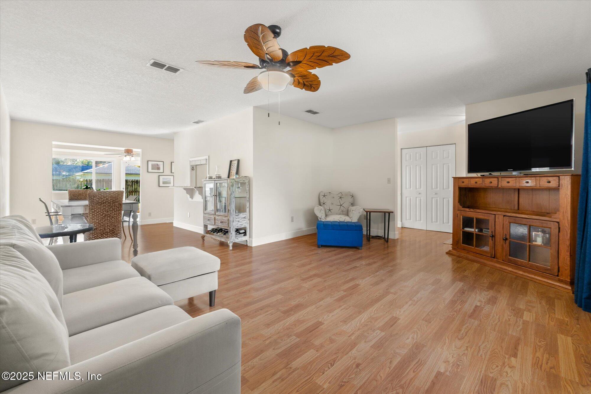904 San Jose Road St. Augustine, FL 32086 - Photo 22 of 31 a living room with furniture and a flat screen tv