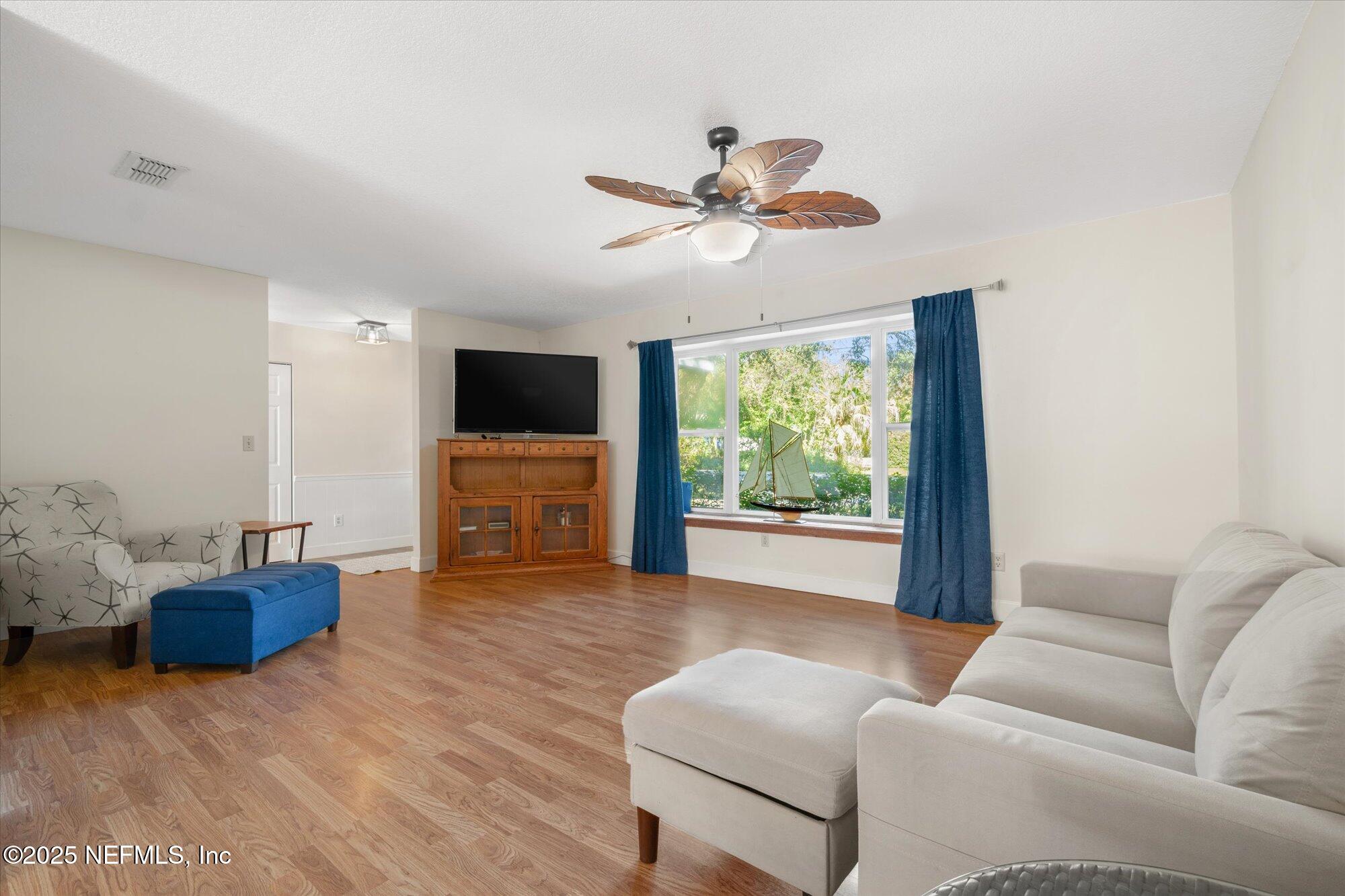 904 San Jose Road St. Augustine, FL 32086 - Photo 23 of 31 a living room with furniture and a flat screen tv