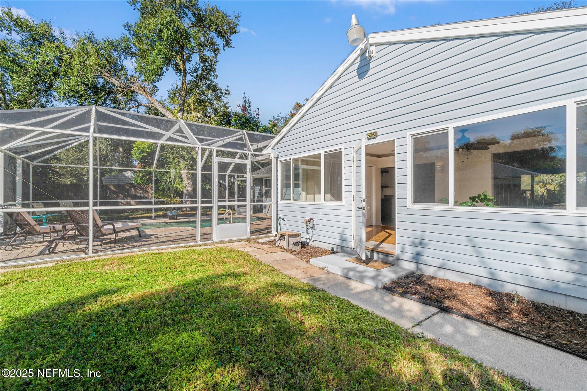 904 San Jose Road St. Augustine, FL 32086 - Photo 26 of 31 a view of a house with backyard and sitting area