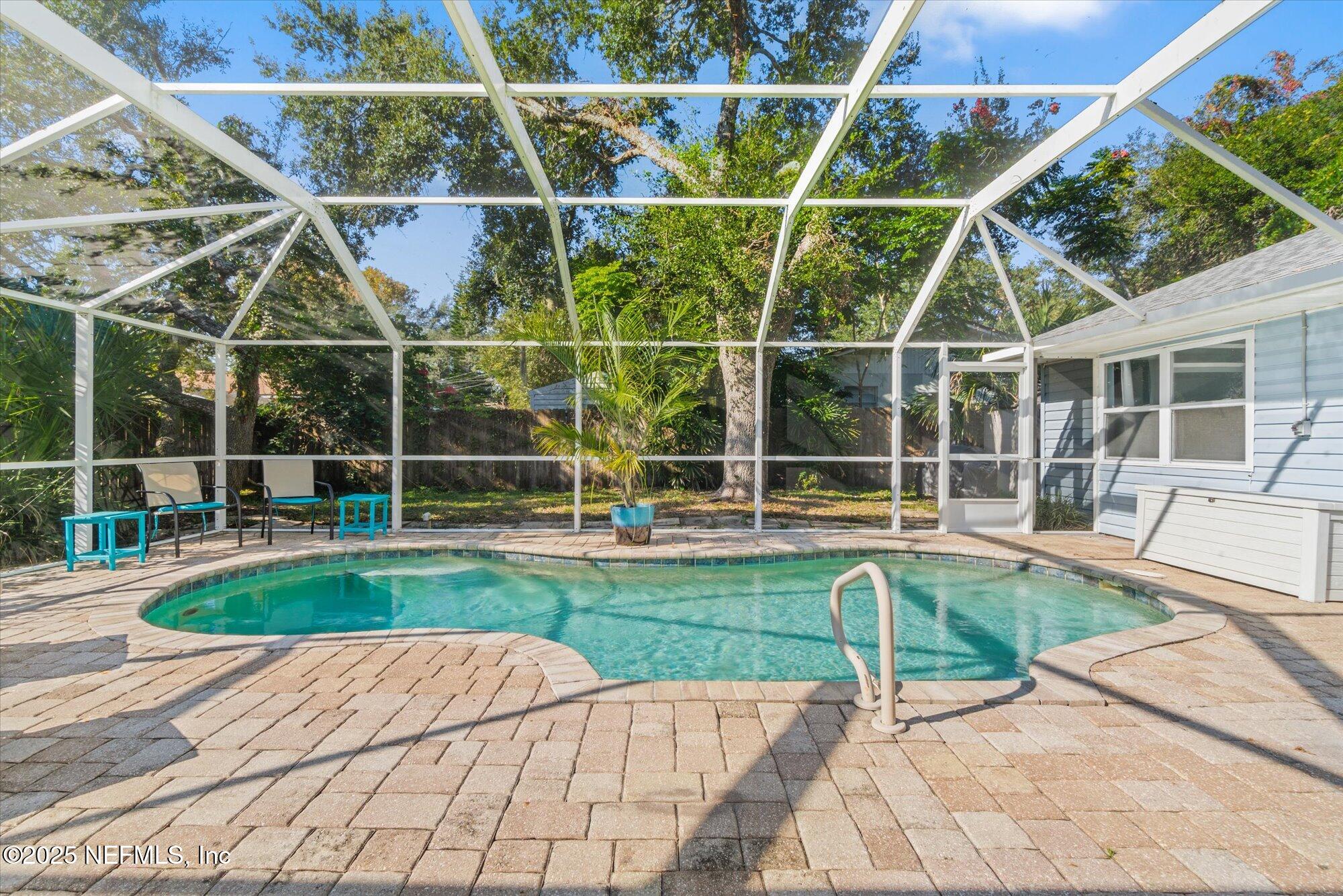 904 San Jose Road St. Augustine, FL 32086 - Photo 27 of 31 a view of a backyard with a wooden floor and fence
