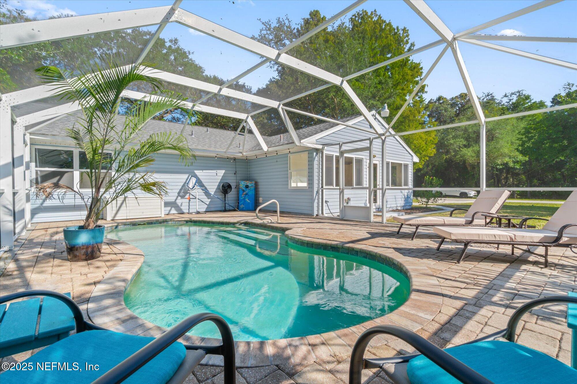 904 San Jose Road St. Augustine, FL 32086 - Photo 30 of 31 a view of swimming pool with outdoor seating