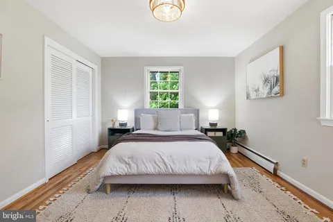 a bedroom with a bed and window