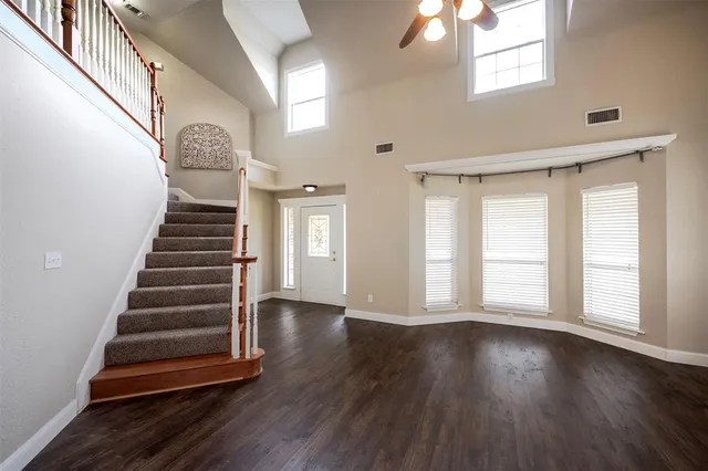 a view of an entryway with wooden floor