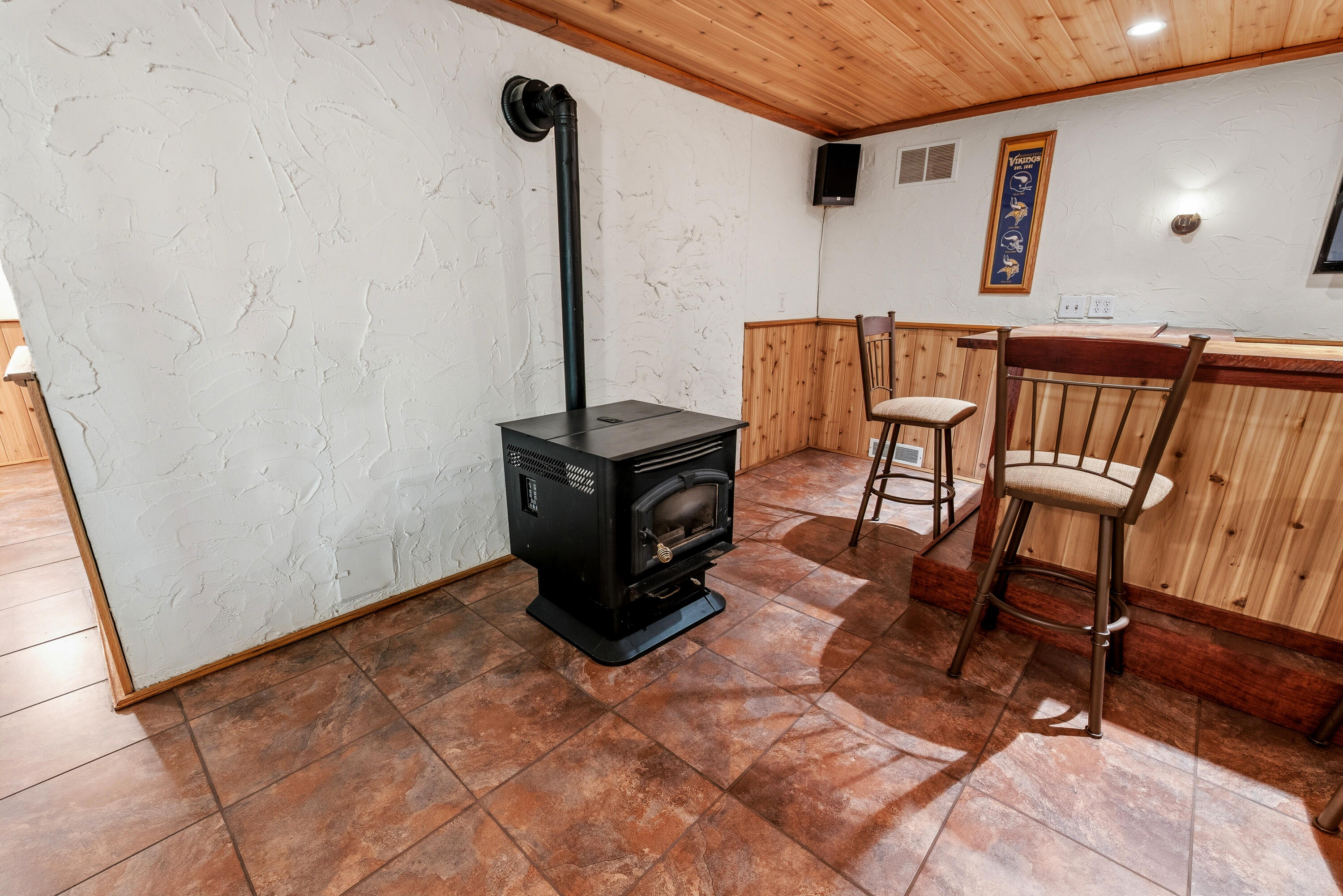 2953 Kettle Moraine Road Hartford, WI 53027 - Photo 42 of 58 Lower Level Bar Area w/ Pellet Stove