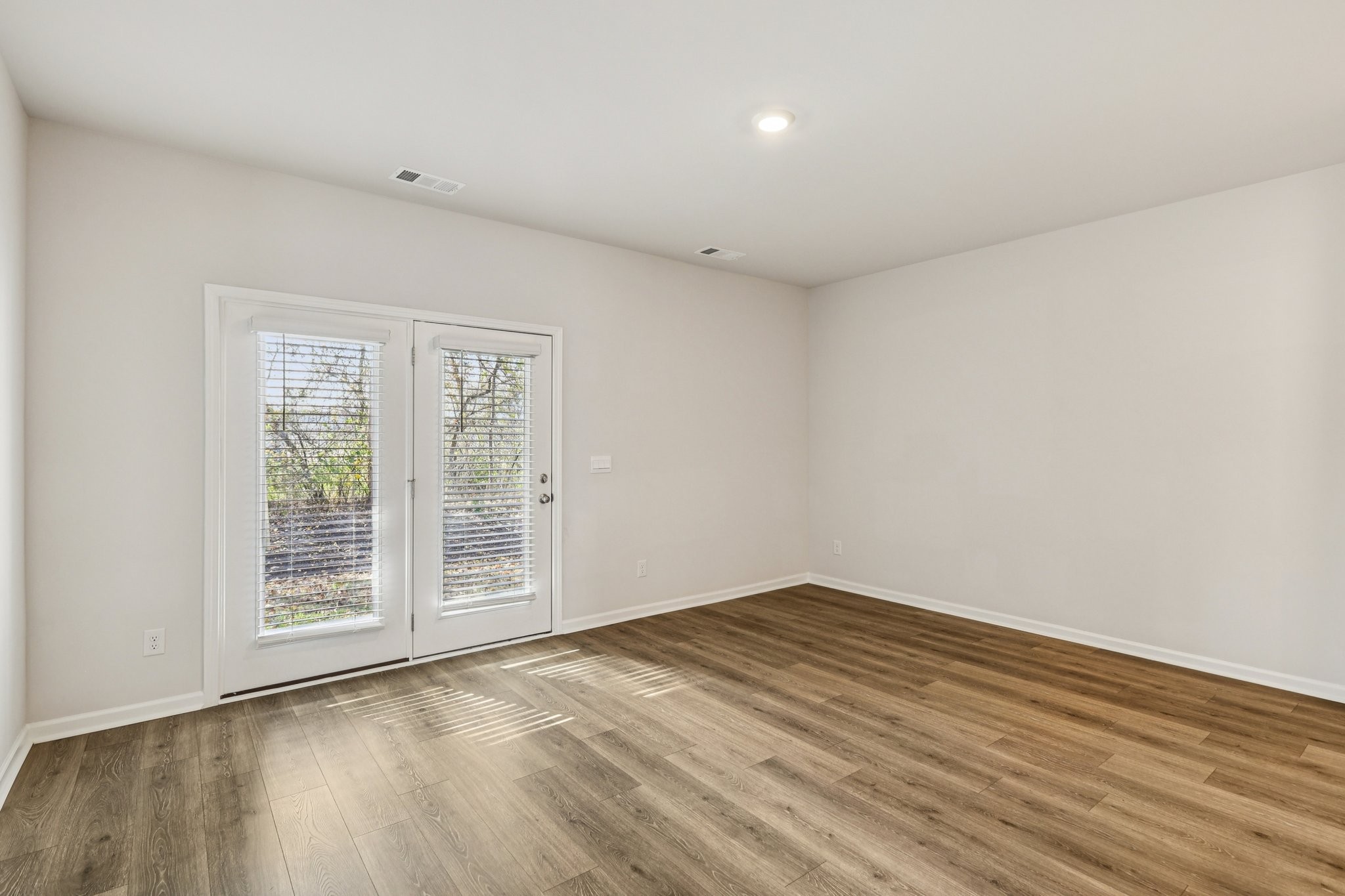160 Cecil Road Lebanon, TN 37087 - Photo 6 of 23 a view of an empty room with wooden floor and a window