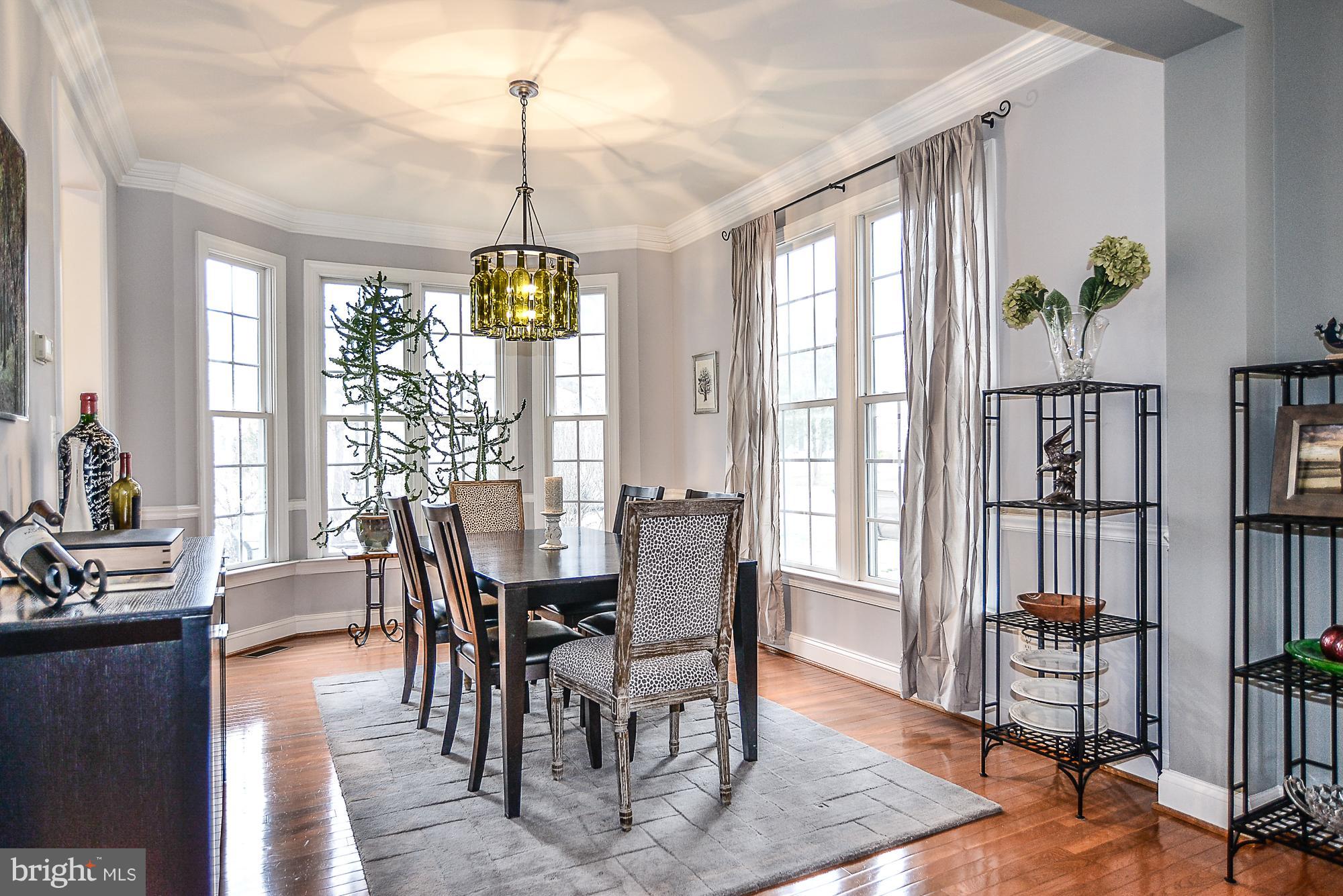 1310 South Glebe Road Arlington, VA 22204 - Photo 3 of 30 Dining room with chair rail and crown molding