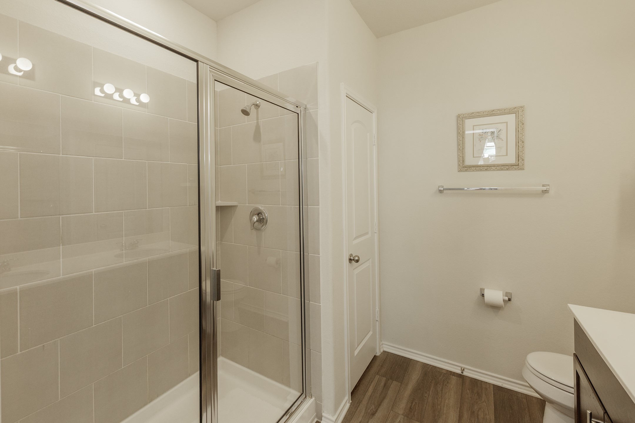 125 Janice Road Taylor, TX 76574 - Photo 12 of 26 Shower enclosure with a clear glass door, chrome hardware, and light-toned subway tile surround