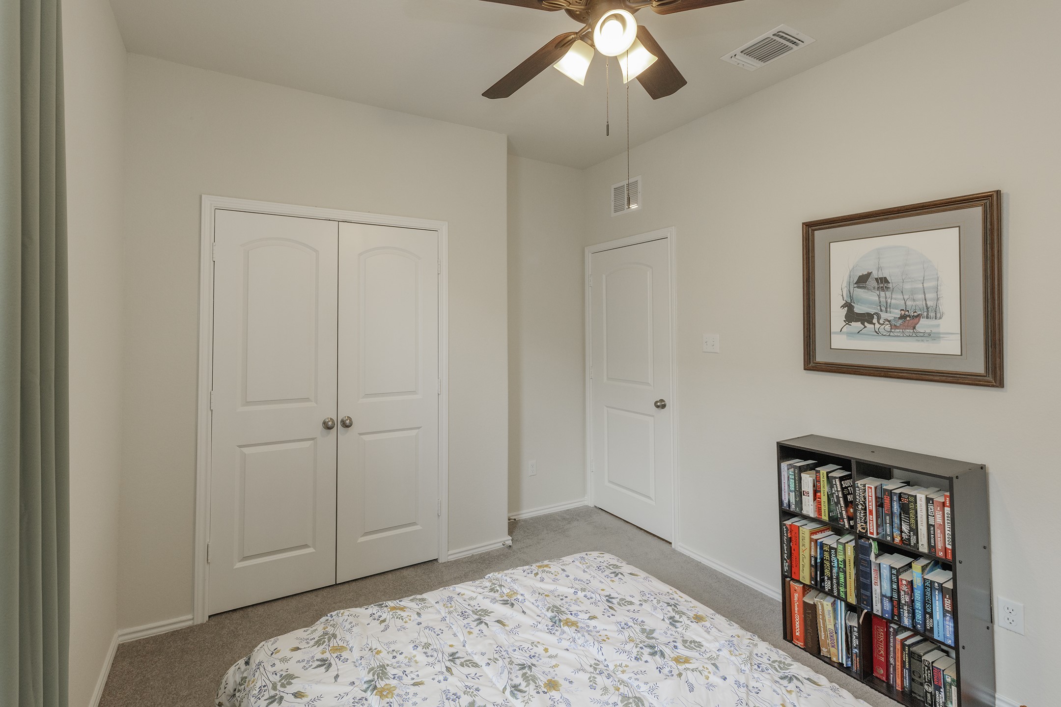 125 Janice Road Taylor, TX 76574 - Photo 18 of 26 Room featuring neutral-toned walls, gray carpet, a ceiling fan with integrated lighting, and a white paneled door