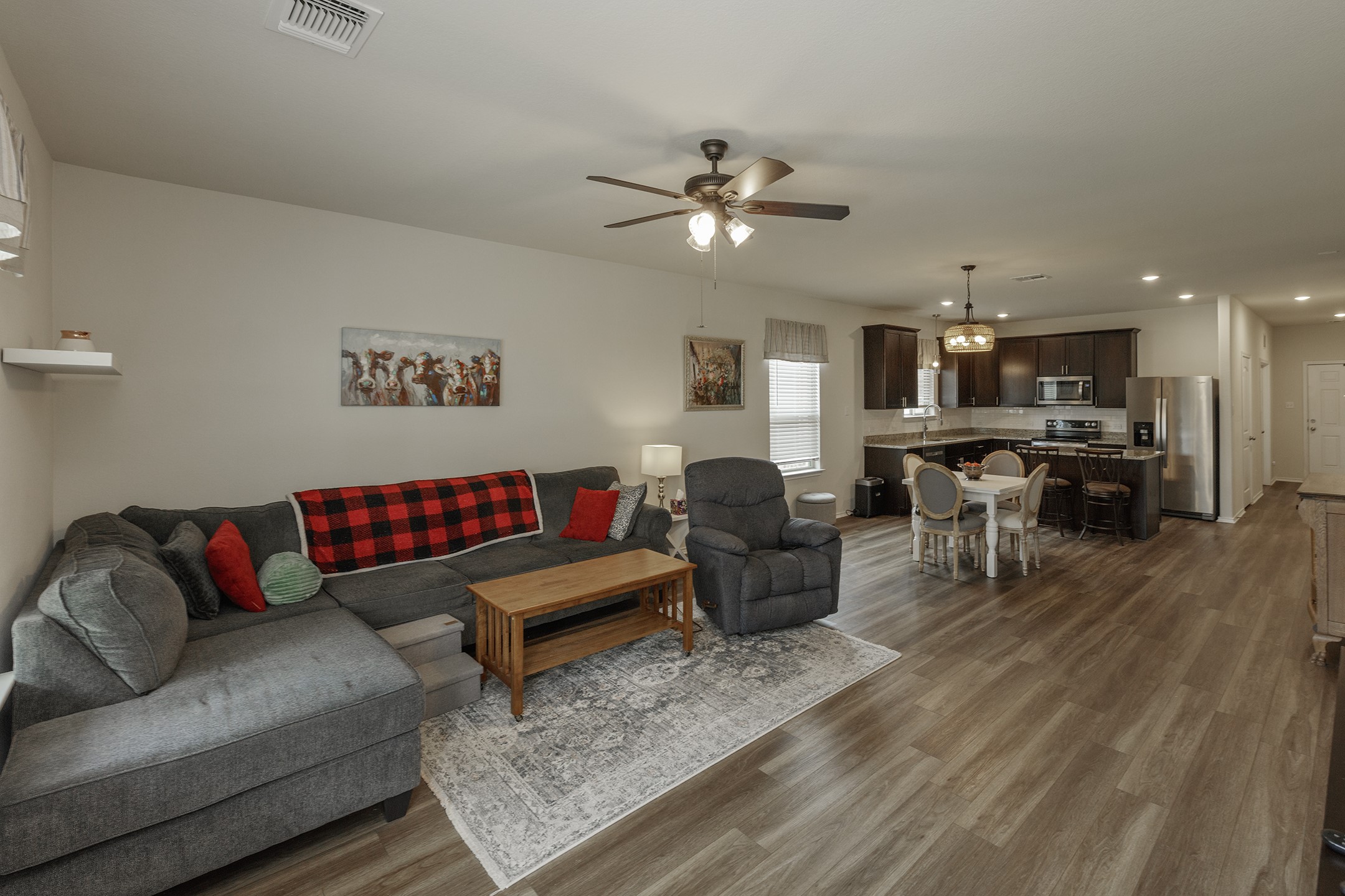 125 Janice Road Taylor, TX 76574 - Photo 7 of 26 Open-concept living space featuring wood-finish flooring, recessed lighting, and a ceiling fan