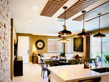 a dining room with furniture and window