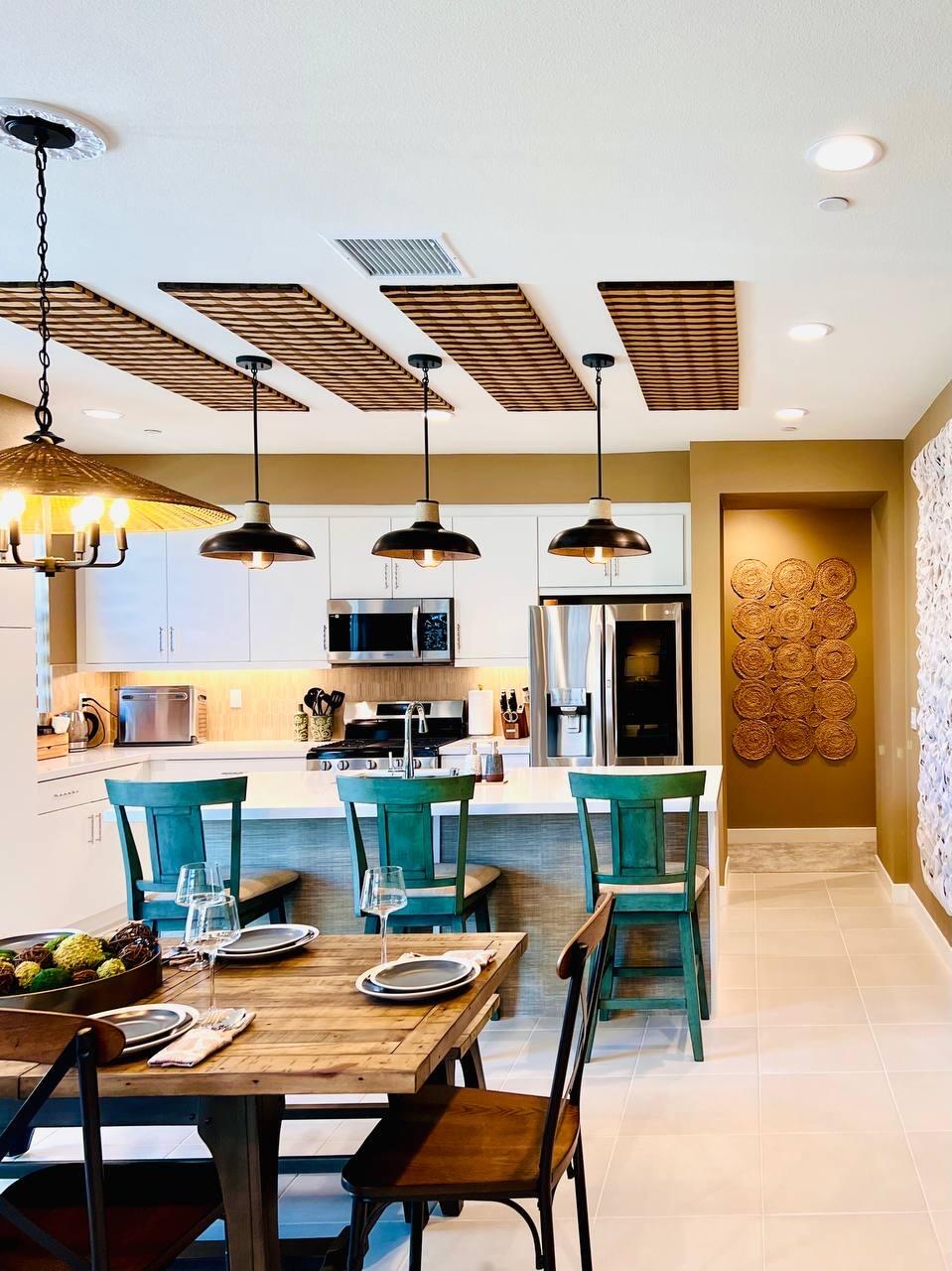 80269 Redstone Way La Quinta, CA 92253 - Photo 11 of 35 a living room with stainless steel appliances kitchen island granite countertop furniture and a fireplace