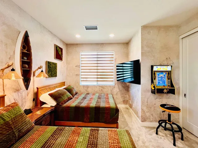 a bedroom with a bed and a window