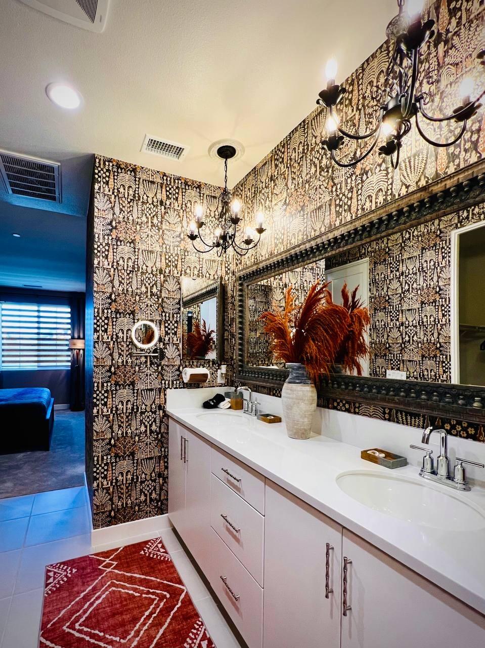 80269 Redstone Way La Quinta, CA 92253 - Photo 28 of 35 a bathroom with a sink a mirror and shower