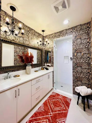 a bathroom with a sink a toilet and mirror