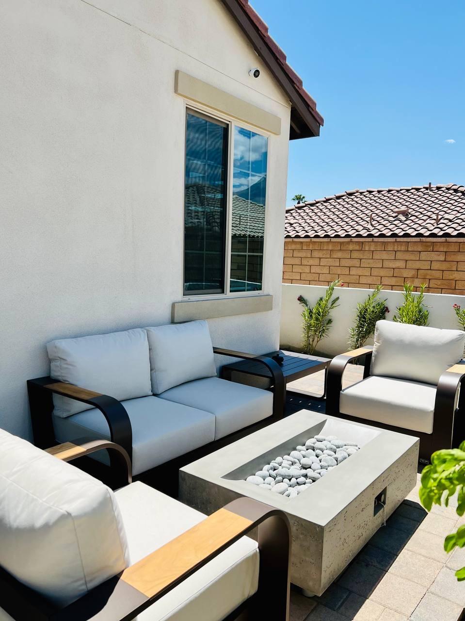 80269 Redstone Way La Quinta, CA 92253 - Photo 35 of 35 a view of a patio with couches and potted plants
