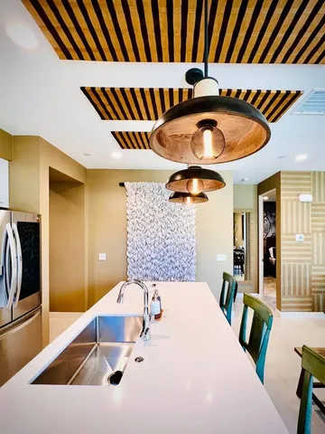 a kitchen with a sink and a refrigerator