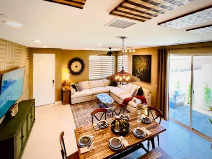 a bedroom with furniture and a wooden floor