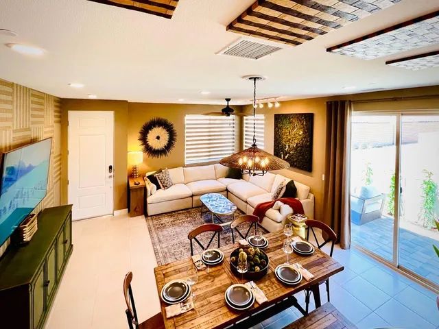 a bedroom with furniture and a wooden floor