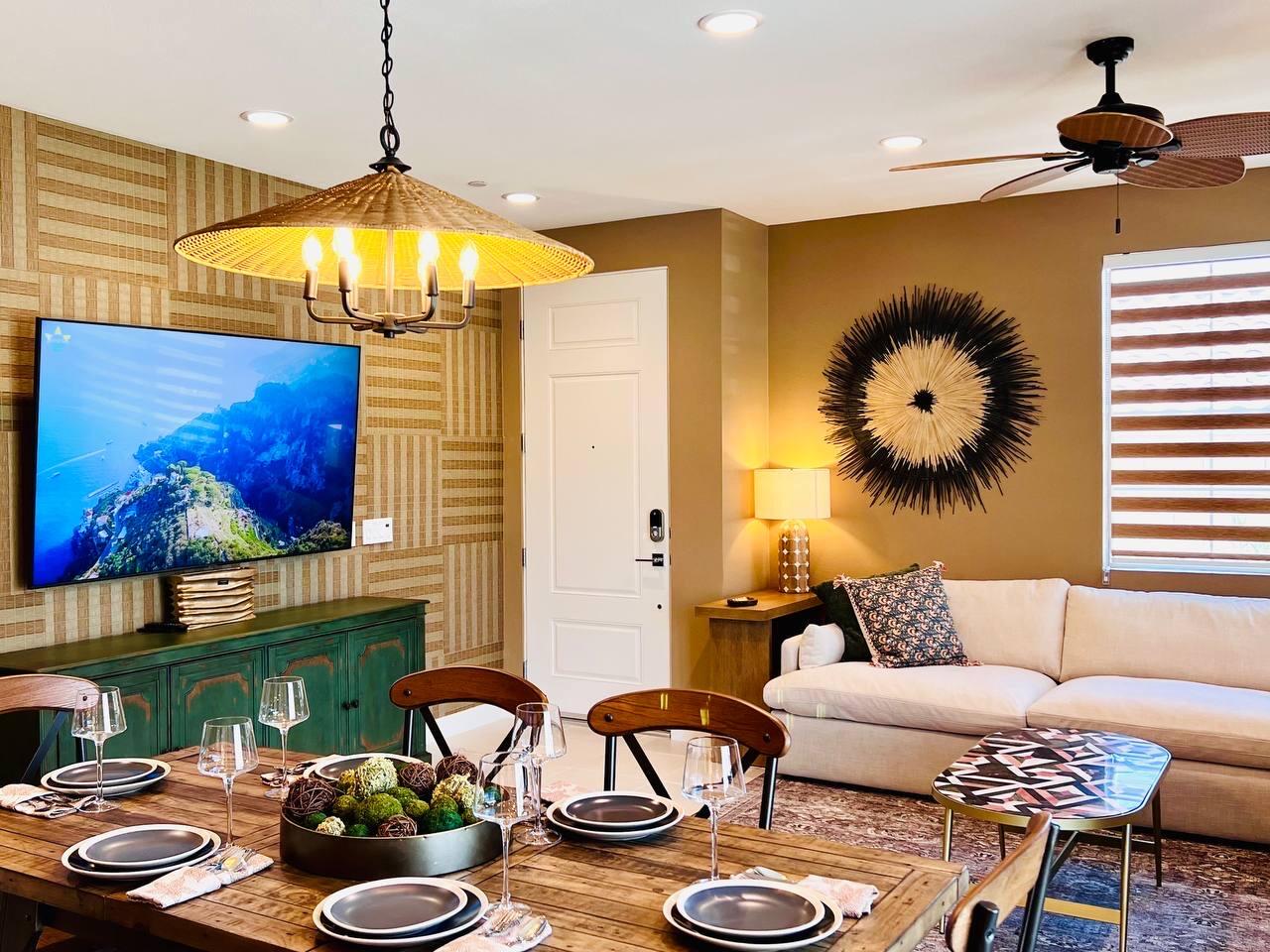 80269 Redstone Way La Quinta, CA 92253 - Photo 10 of 35 a living room with furniture and a chandelier