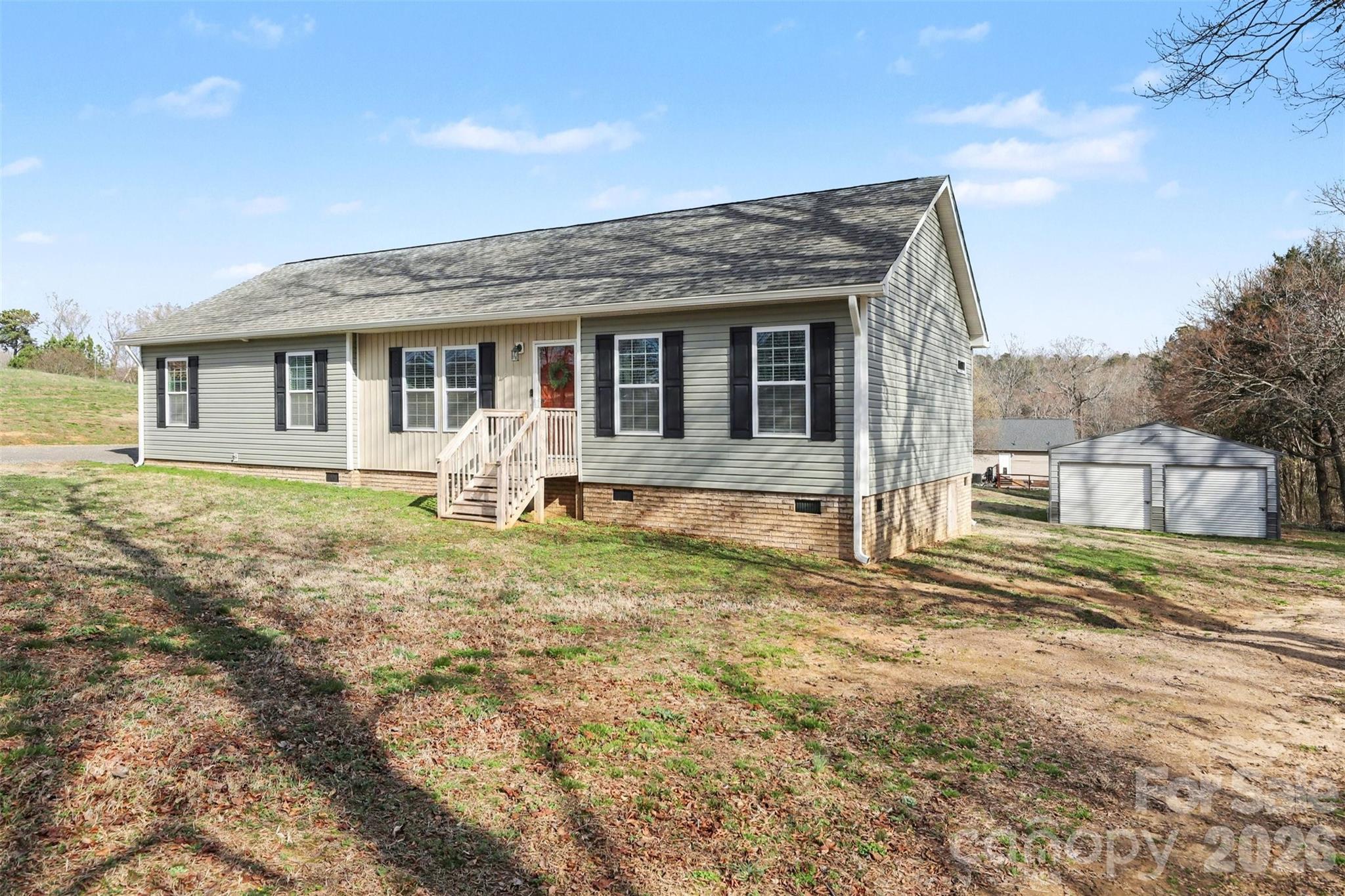 193 Back Acres Lane Kannapolis, NC 28081 - Photo 2 of 23 a front view of a house with garden