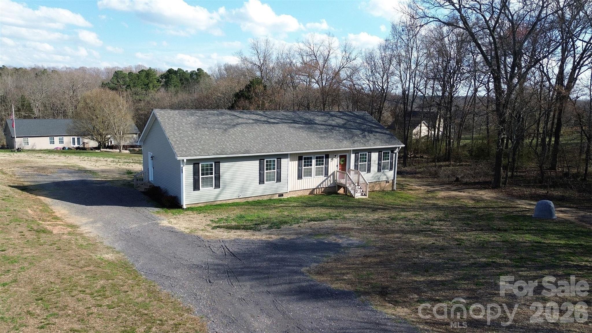 193 Back Acres Lane Kannapolis, NC 28081 - Photo 22 of 23 a view of a yard in front of a house with large trees
