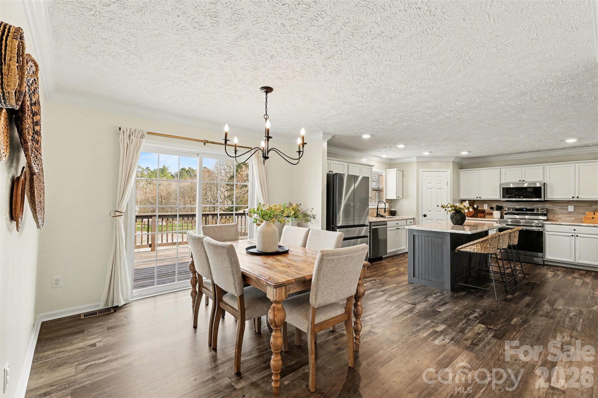193 Back Acres Lane Kannapolis, NC 28081 - Photo 3 of 23 a view of a dining area with furniture window and wooden floor