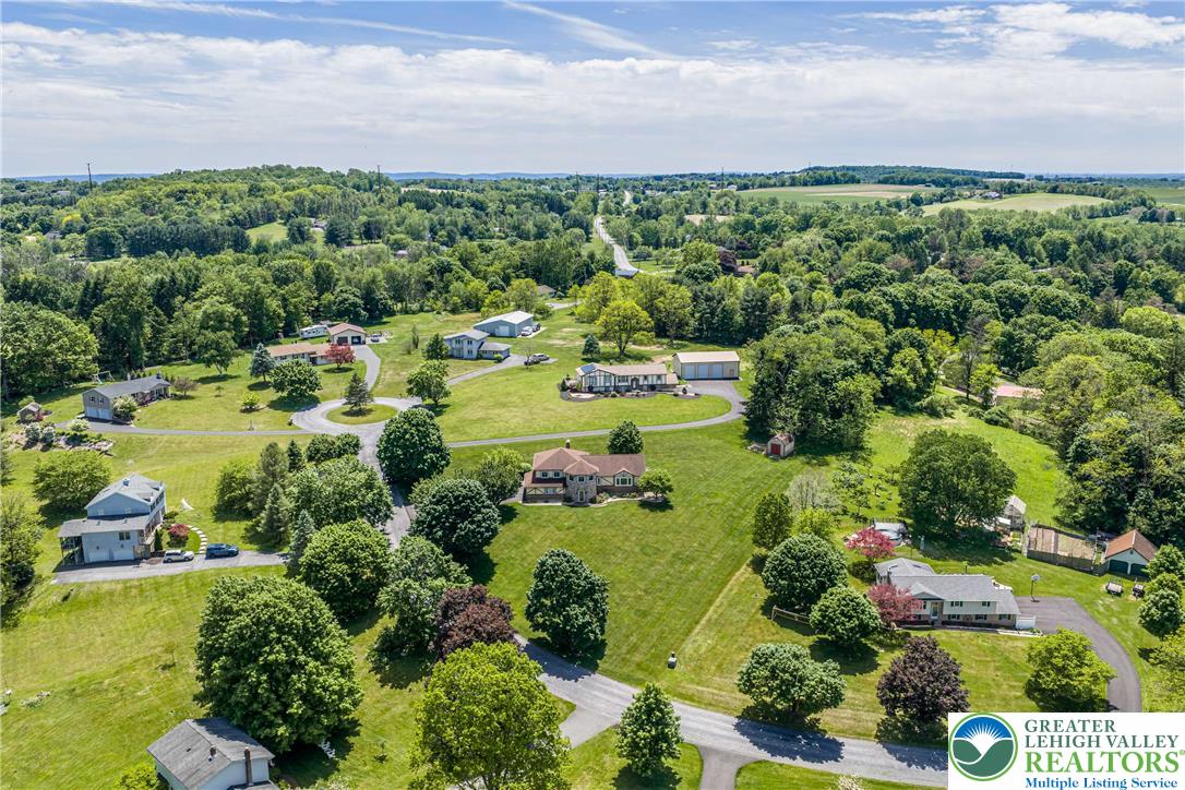 947 Tamenend Road Bath, PA 18014 - Photo 52 of 61 An aerial perspective reveals a serene community nestled amidst rolling hills and abundant greenery.