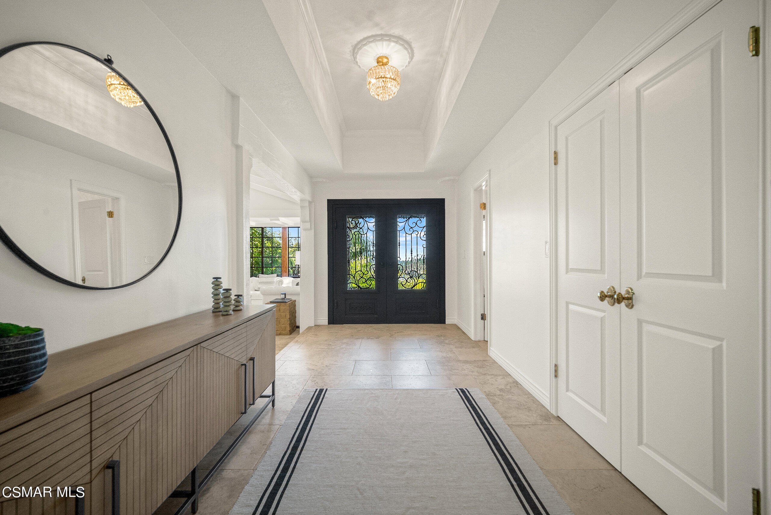 11875 Pradera Road Camarillo, CA 93012 - Photo 11 of 58 a view of a hallway with wooden floor windows a mirror and a sink