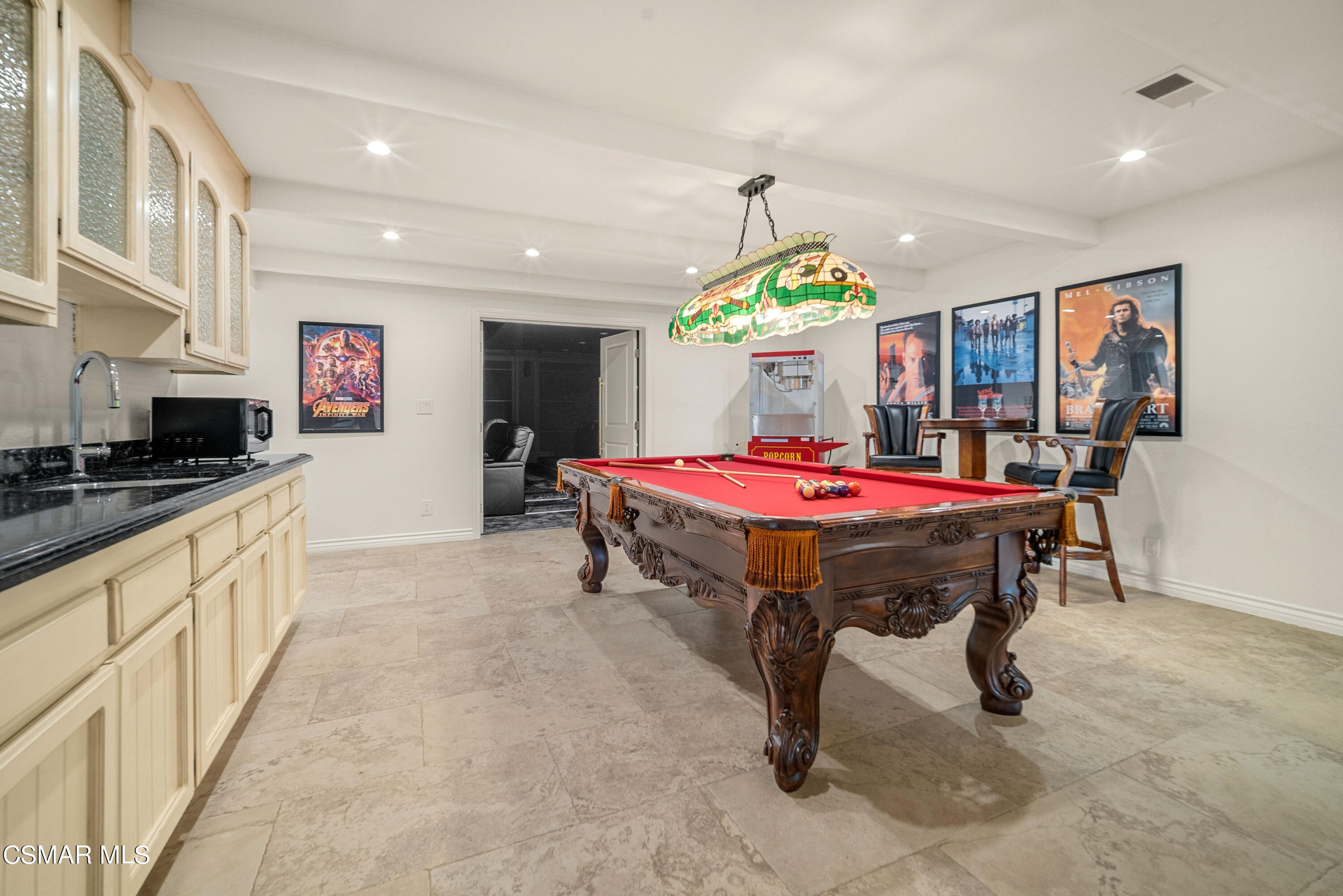 11875 Pradera Road Camarillo, CA 93012 - Photo 28 of 58 a kitchen with stainless steel appliances kitchen island granite countertop a sink a stove and a wooden floors