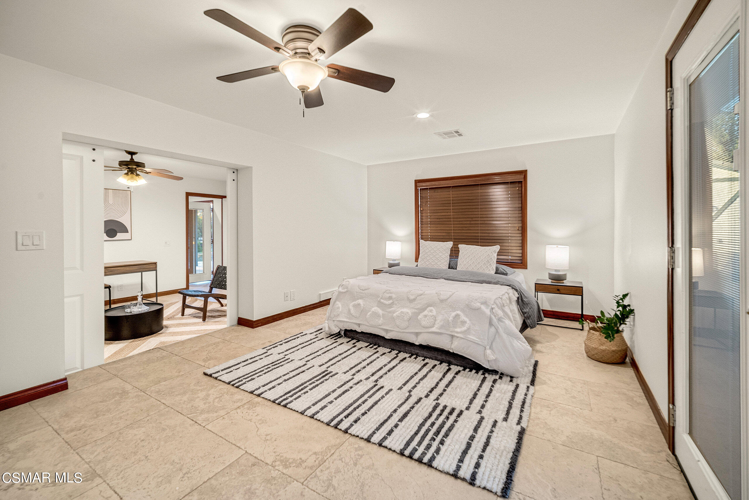 11875 Pradera Road Camarillo, CA 93012 - Photo 42 of 58 a bedroom with a large bed and a chandelier