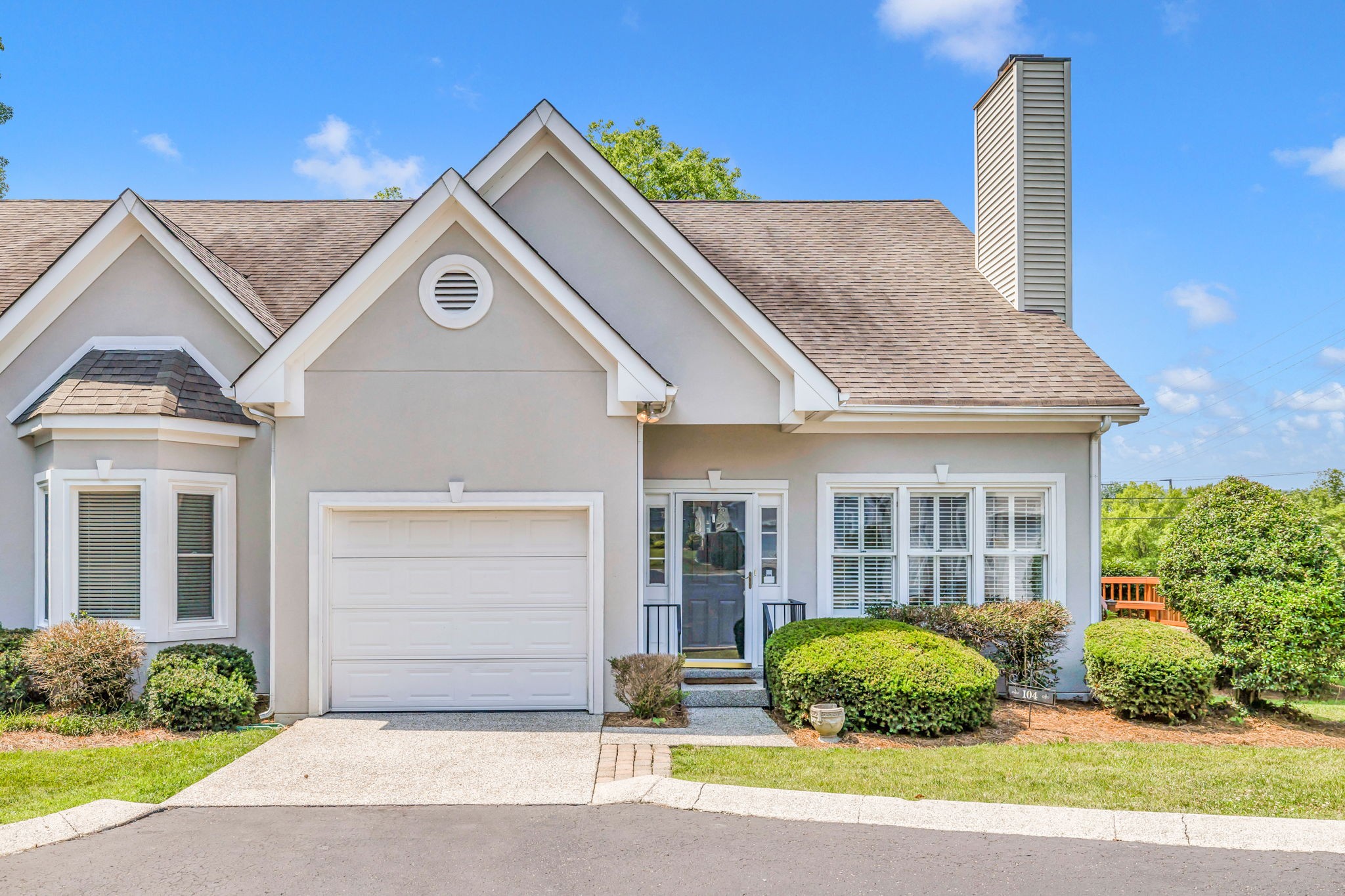 104 Hicks Road Nashville, TN 37221 - Photo 1 of 41 a front view of a house with a garden and plants