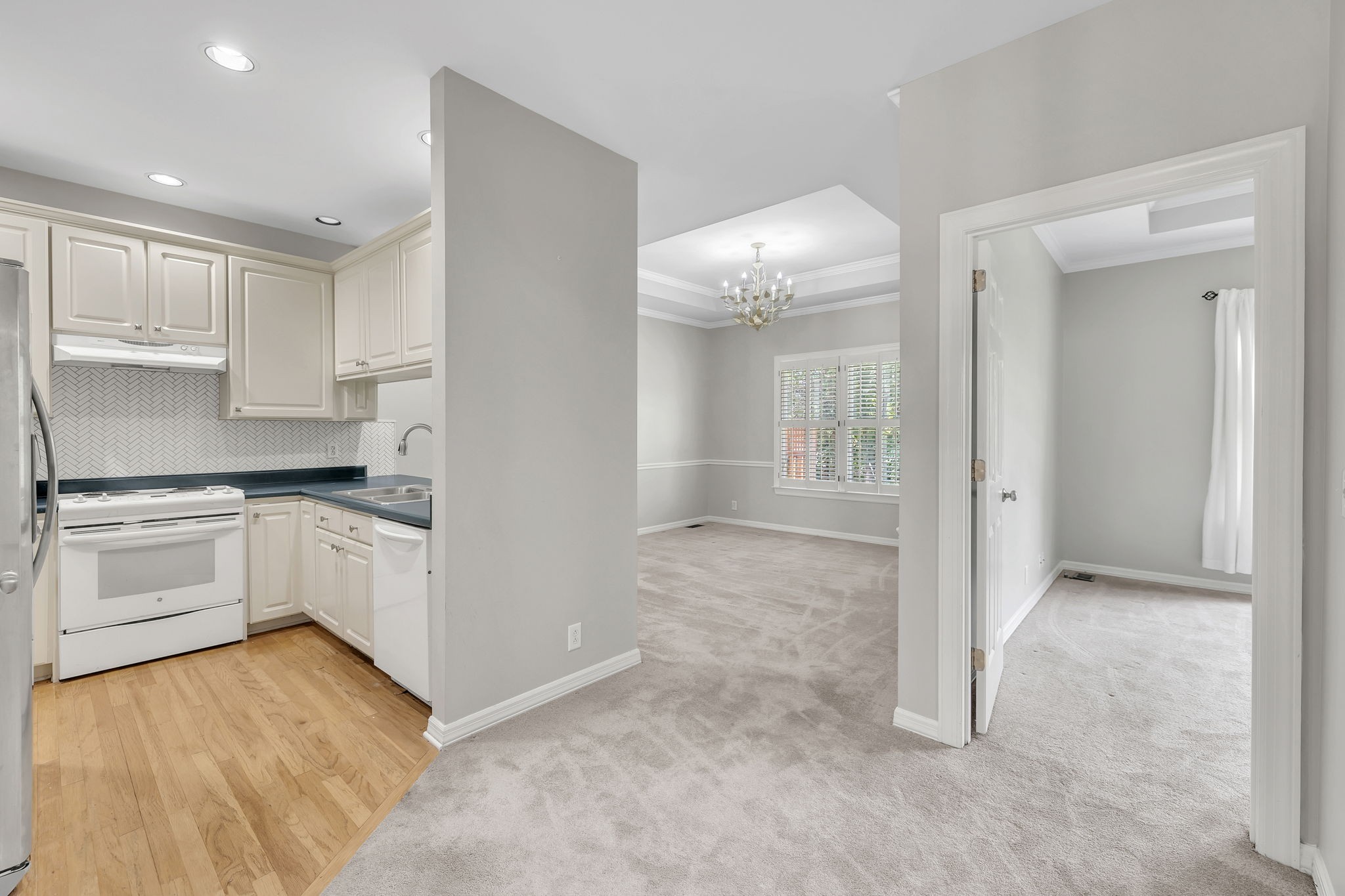 104 Hicks Road Nashville, TN 37221 - Photo 12 of 41 a kitchen with a refrigerator and white cabinets