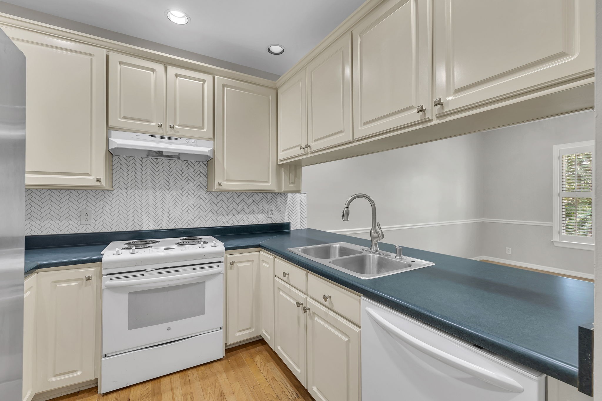 104 Hicks Road Nashville, TN 37221 - Photo 14 of 41 a kitchen with white cabinets and white appliances