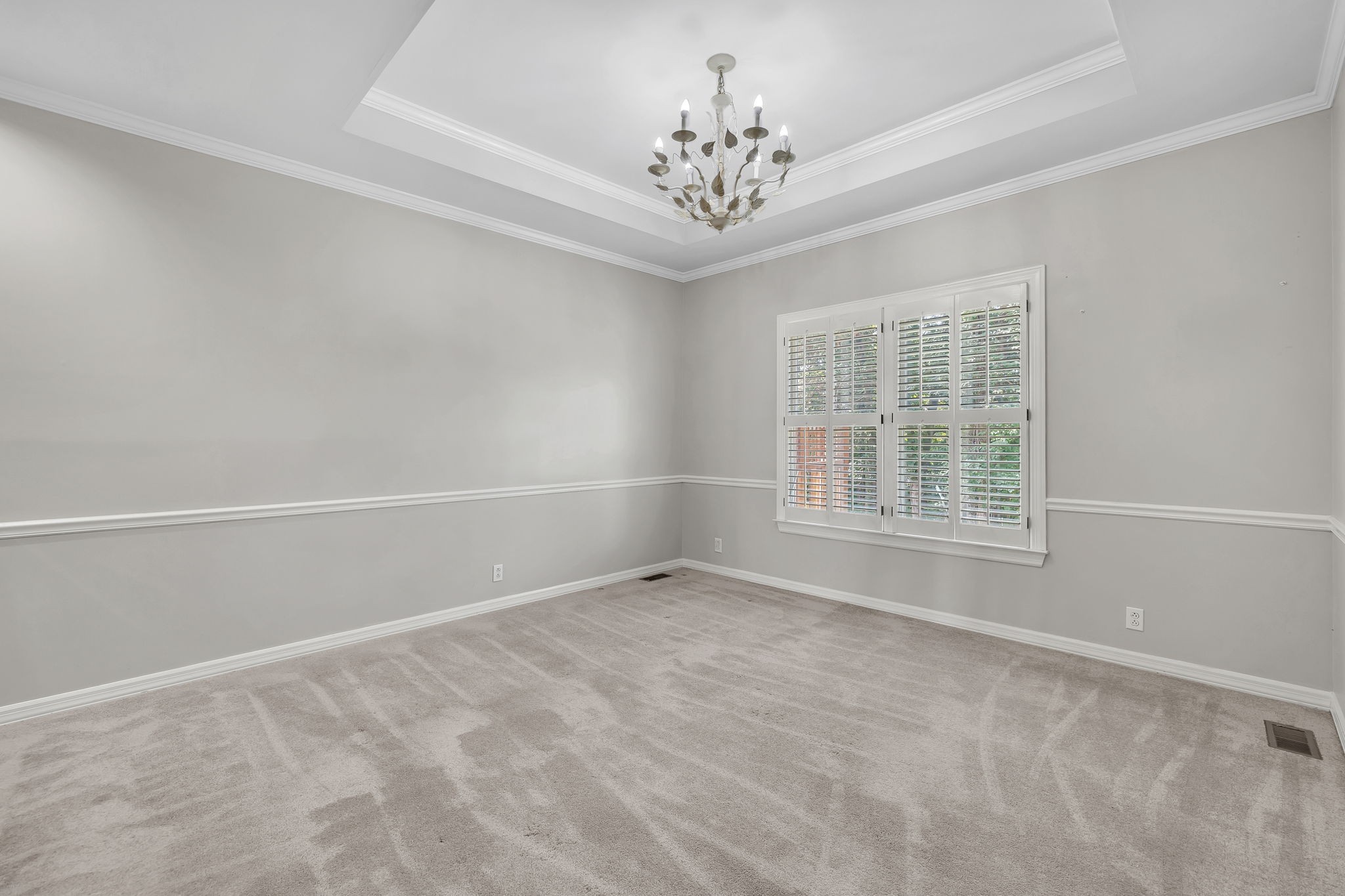 104 Hicks Road Nashville, TN 37221 - Photo 18 of 41 en empty room with windows and chandelier