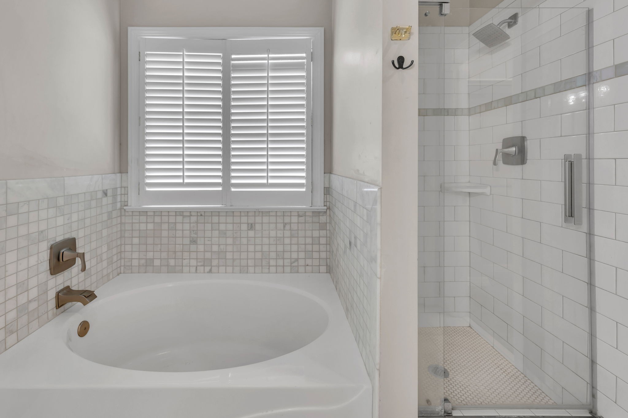 104 Hicks Road Nashville, TN 37221 - Photo 24 of 41 a white bath tub sitting next to a window