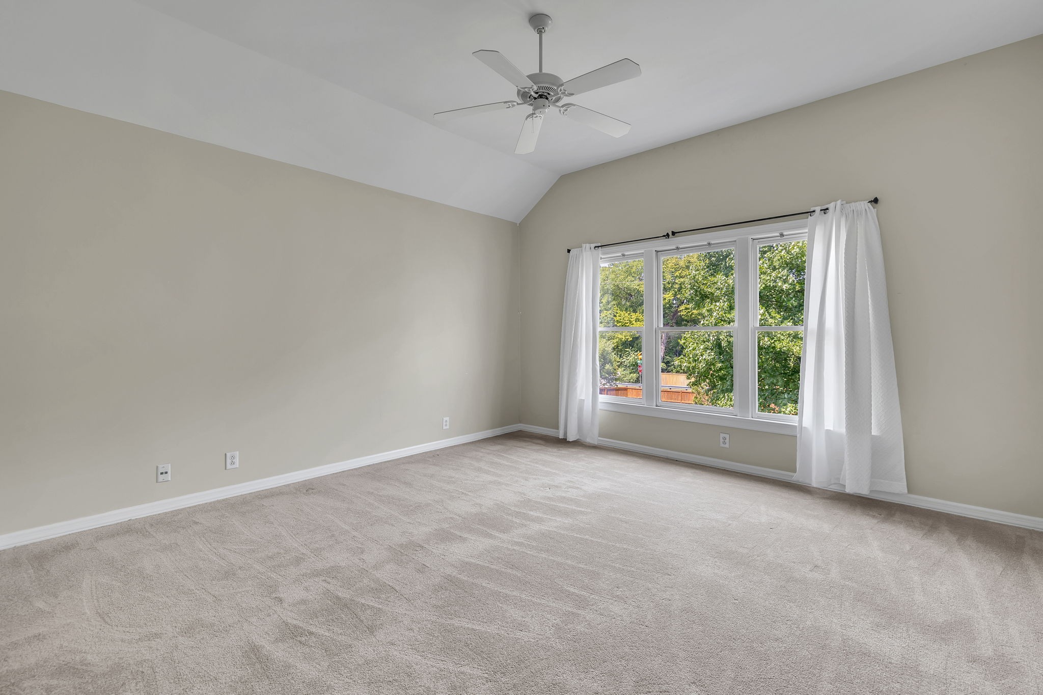104 Hicks Road Nashville, TN 37221 - Photo 28 of 41 a view of a big room with windows and chandelier fan
