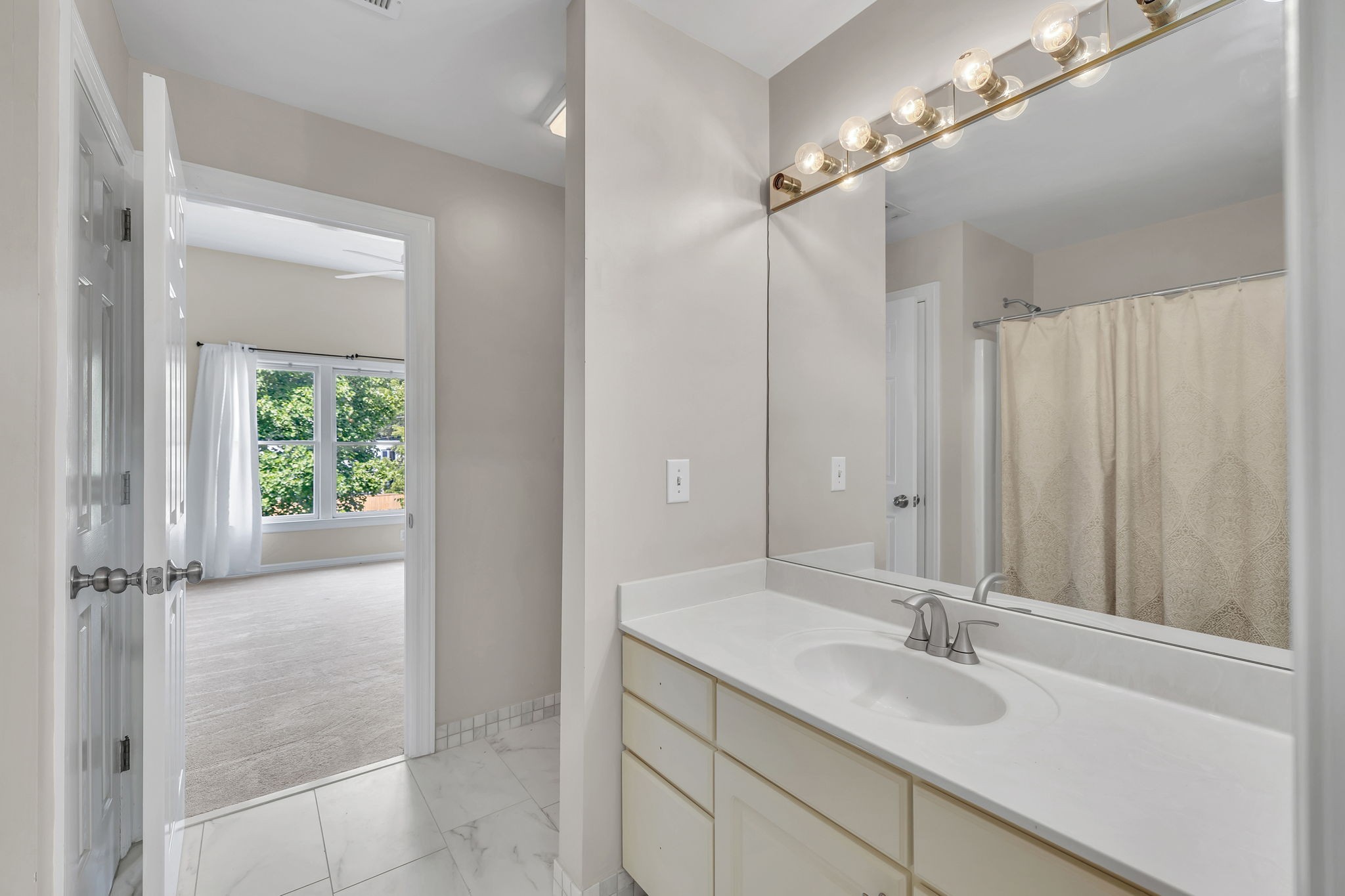 104 Hicks Road Nashville, TN 37221 - Photo 31 of 41 a bathroom with a double vanity sink and a mirror