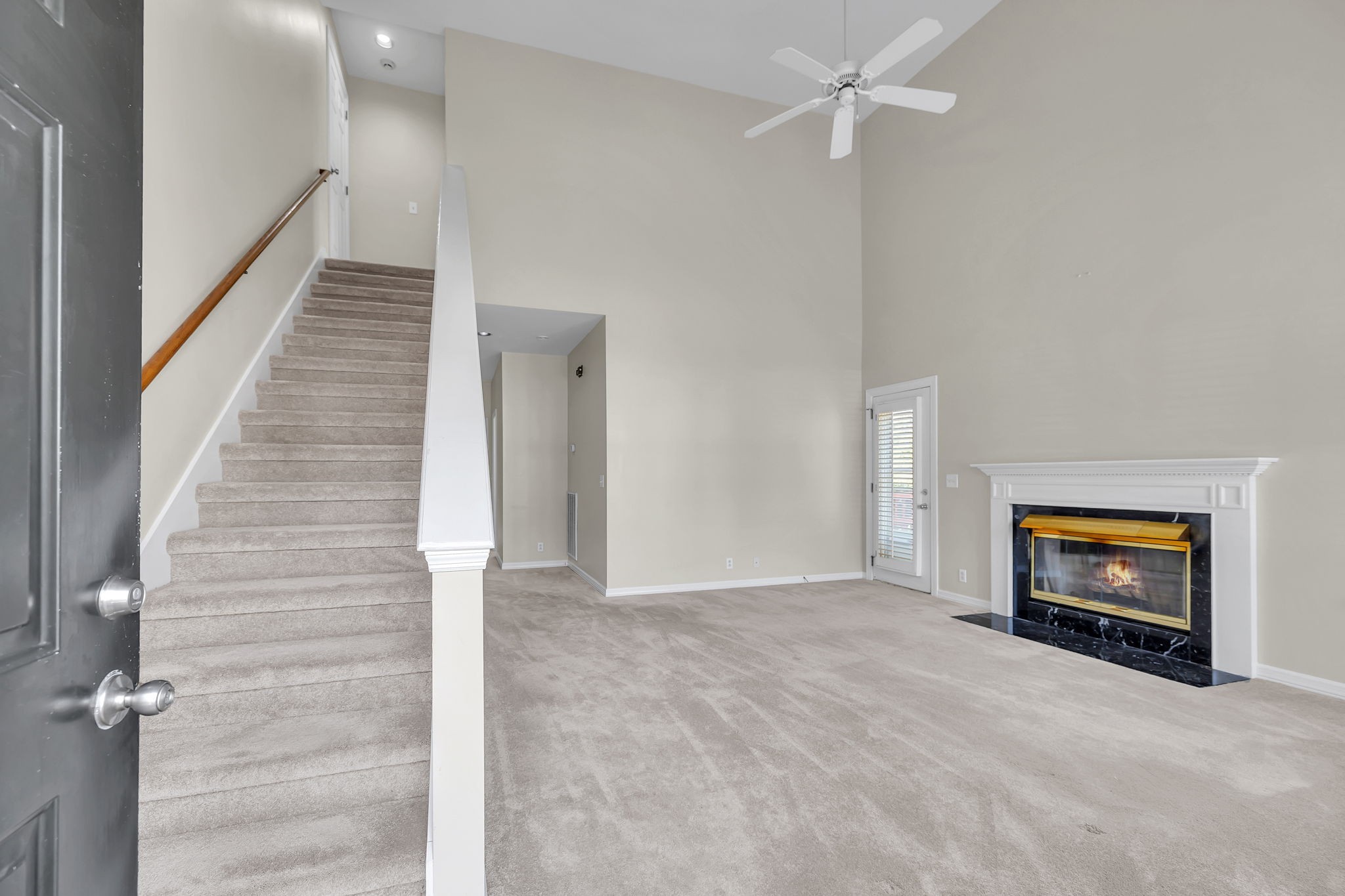 104 Hicks Road Nashville, TN 37221 - Photo 8 of 41 wooden floor in an empty room with a fireplace