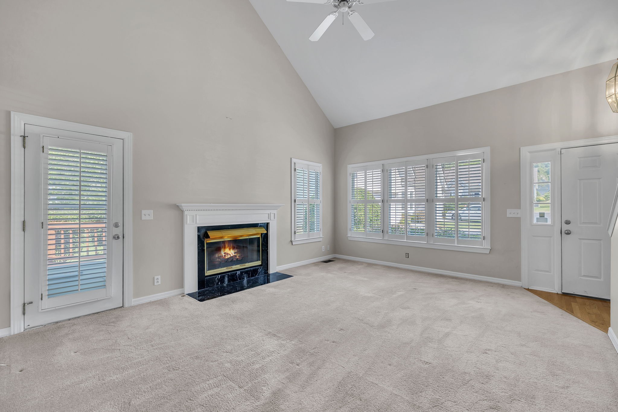 104 Hicks Road Nashville, TN 37221 - Photo 9 of 41 an empty room with windows and fireplace