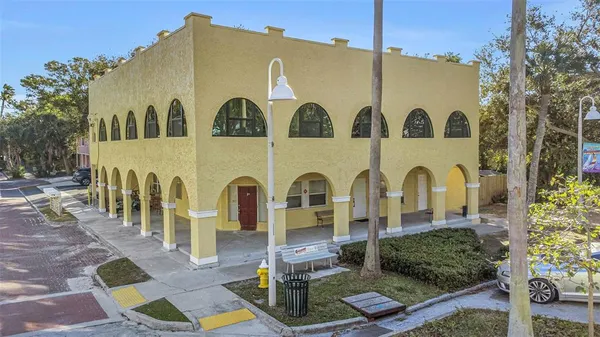 a front view of residential houses with outdoor space