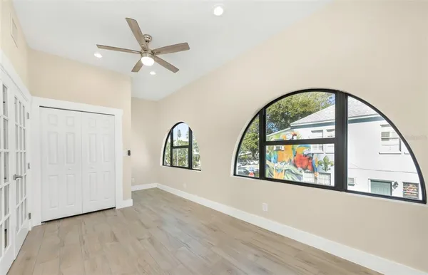 wooden floor in an empty room with a window