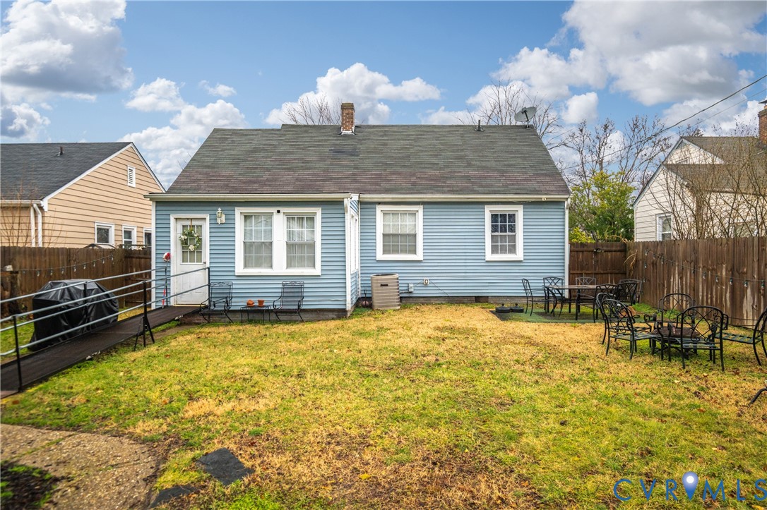 1311 Williamsburg Road Richmond, VA 23231 - Photo 32 of 38 Expansive backyard with a blue siding exterior, a